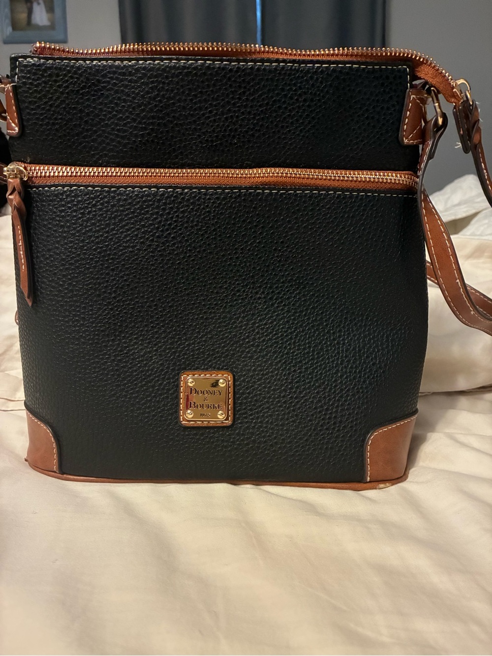 Dooney & Bourke Black with Brown Trim Pebbled Leather Bucket/Crossbody Bag